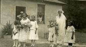 Portrait of an African American bride with bridesmaid and flower girls in Hibernia.