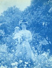Winifred Bridge (later Latham) holding young child and flowers in Dade City.