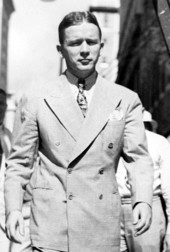 Fuller Warren walking under a ladder.