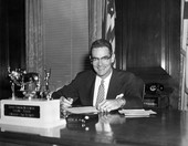 Florida Governor Dan McCarty signing papers at his desk - Tallahassee, Florida.
