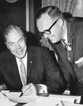 Florida Governor Haydon Burns signing papers.