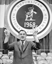 Florida Governor Claude Kirk gesturing with both hands the victory sign.