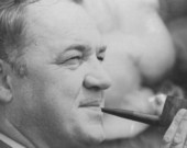 Florida Governor Claude Kirk smoking a pipe.