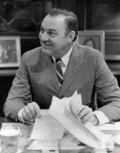 Florida Governor Claude Kirk shuffling papers.