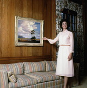 Florida Governor Bob Graham's wife Adele with a painting by "Bean" Backus.
