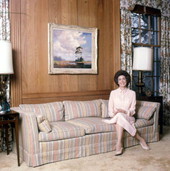 Florida Governor Bob Graham's wife Adele with a painting by "Bean" Backus.