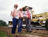 Florida Governor Bob Martinez standing with road construction workers on I-10.