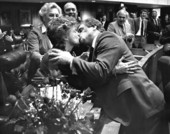 Representatives kissing on the floor of the Florida House.