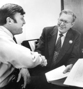 William France, campaign manager for George Wallace, shakes hands with Jon Moyle, Florida Democratic chairman