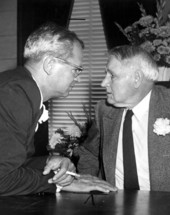Two unidentified politicians talking things over
