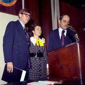 Representative Ralph Turlington speaking at the podium in the Florida House of Representatives.