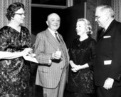 Allen Morris and Edward Ball enjoying cocktails with friends.