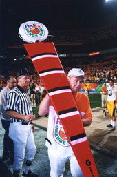 U.S. Senator Bob Graham during workday as a member of the Orange Bowl chain crew at Pro-Player stadium.