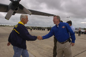 View showing Governor Charlie Crist, left, shaking hands with Lieutenant governor Jeff Kottkamp during Tropical Storm Fay.