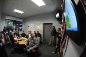 View showing Governor Charlie Crist meeting with Division of Emergency Management personnel during Tropical Storm Fay.