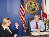 Attorney General Bill McCollum briefing political candidate Pam Bondi at his Capitol office in Tallahassee, Florida.