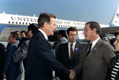 Secretary of State Jim Smith greeting Vice-President George Bush.