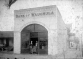 J.C. McEwen (left) standing with O.P. Cowart at the Bank of Wauchula