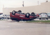 View of minivan overturned by Hurricane Andrew - Miami, Florida.