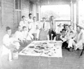 People having a picnic on the porch - Miami Beach, Florida.