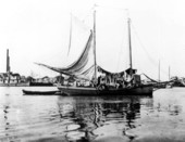 Man and his laundry on oyster boat - Apalachicola, Florida