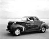 Jack Etheridge seated in Bill Milam's "Special 1" stock race car - Daytona Beach, Florida