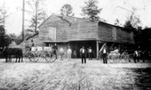 Men and wagons outside Henry Edward's old cotton gin - Lloyd, Florida