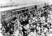 Crowds greet arrival of Henry Flagler and the first train - Key West, Florida.