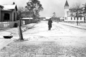 Mayor A.L. VonKern standing on snow covering street - Starke, Florida