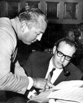 Representatives Ray Mattox (left) and Kenneth M. "Ken" Myers discussing a proposed bill for pollution study on the House floor - Tallahassee, Florida.