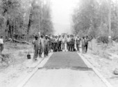 Road crew posing while laying down asphalt for a new road - Polk County, Florida