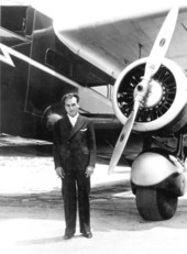 Captain E. J. Kershaw standing next to a National Airlines' airplane