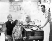 Kalfas brothers with their grandfather in the kitchen - Tallahassee, Florida.