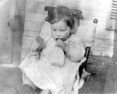 Child with bread and bottle