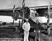 Men posed in front of a tri-motor Fokker airplane - Key West, Florida