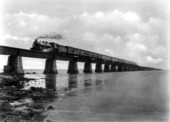 FEC Railway passenger train traveling across Seven Mile Bridge on the Key West extension of the Overseas Railroad.