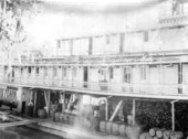 Fannie Fearn loaded with barrels and fuelwood at dock on the Apalachicola River