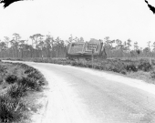Looking down an early "Highway" towards a billboard for United States Tires - Oldsmar, Florida.