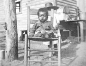 African American toddler sitting in a chair - Eustis, Florida