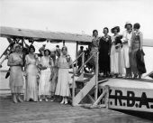 Young women at the first flight of an airline's seaplane.