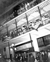 Parade viewers on balconies of building west of Las Novedades Restaurant in Ybor City - Tampa, Florida.