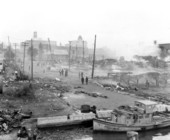 Two part view of devastation at waterfront caused by fire - Tampa, Florida.