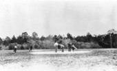 Golfers on the clay green at the New Ocklawaha Hotel golf course - Eustis, Florida