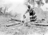 Seminole woman at cooking fire