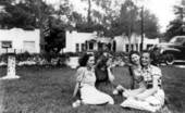 Girls sitting on the lawn together - Tallahassee, Florida.