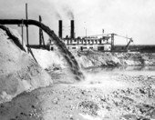 Dredge "Welatka" behind spouting drain pipe on the Kissimmee River