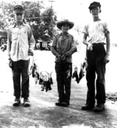 Boatwright brothers holding their catch of rats - Monticello, Florida