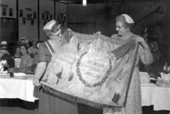 Mrs. R.B. Sensabaugh presents a Confederate flag to Mrs. O. C. Mayo - Tallahassee, Florida.