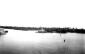 Bagdad Land and Lumber Company tugboat with barges of lumber
