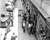 Crowd watching television set in store window - Jacksonville, Florida.